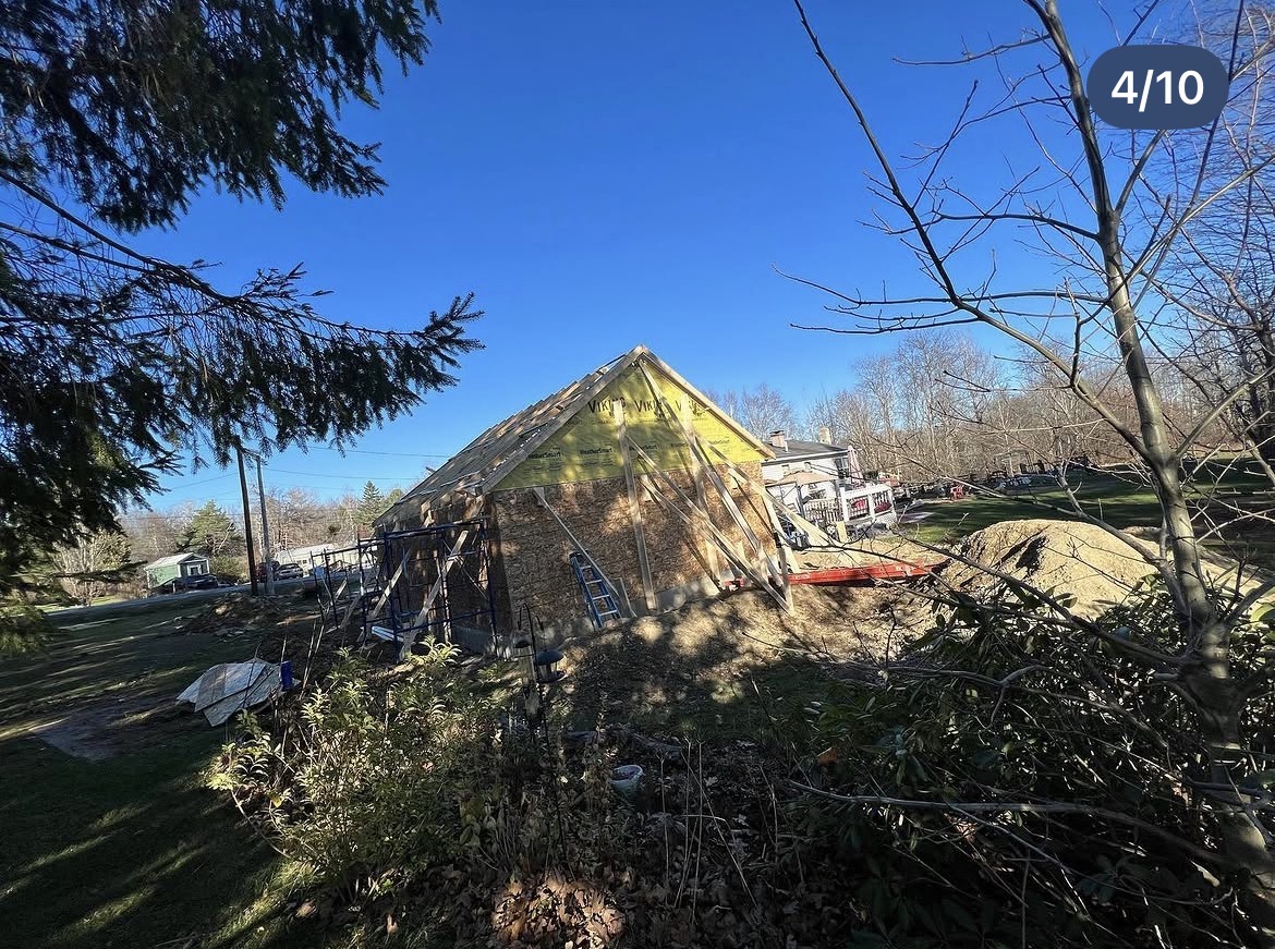 New garage with roof sheathing and Viking weather barrier on the gable end