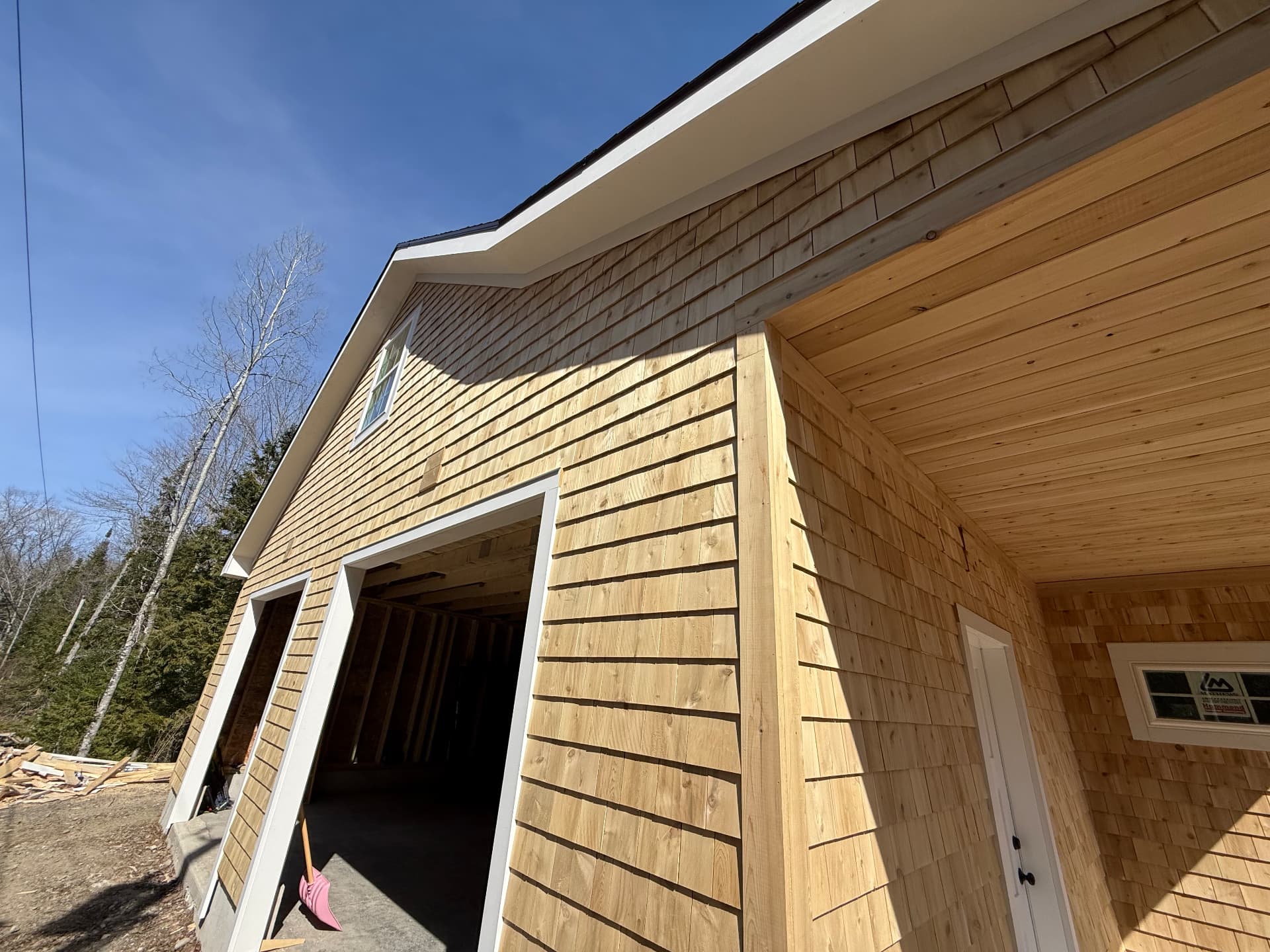 Cedar shingle siding and tongue-and-groove porch ceiling detail