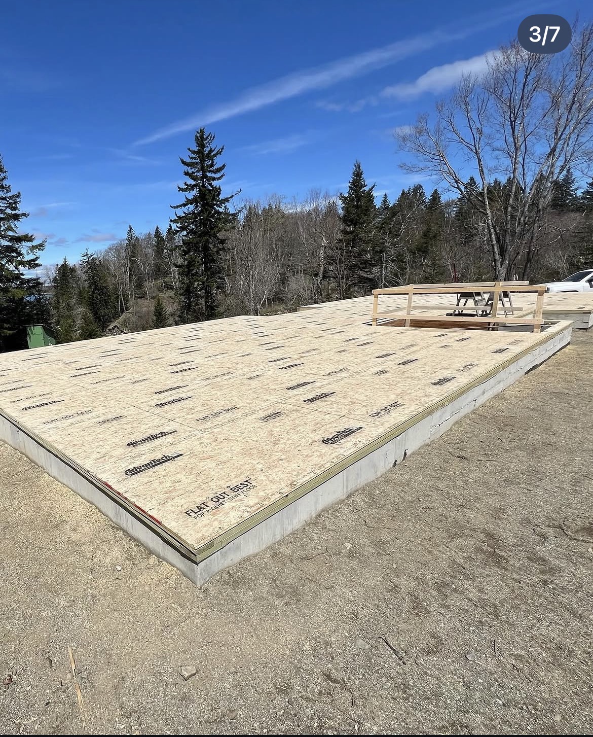 AdvanTech subfloor complete over the new foundation on a wooded coastal lot