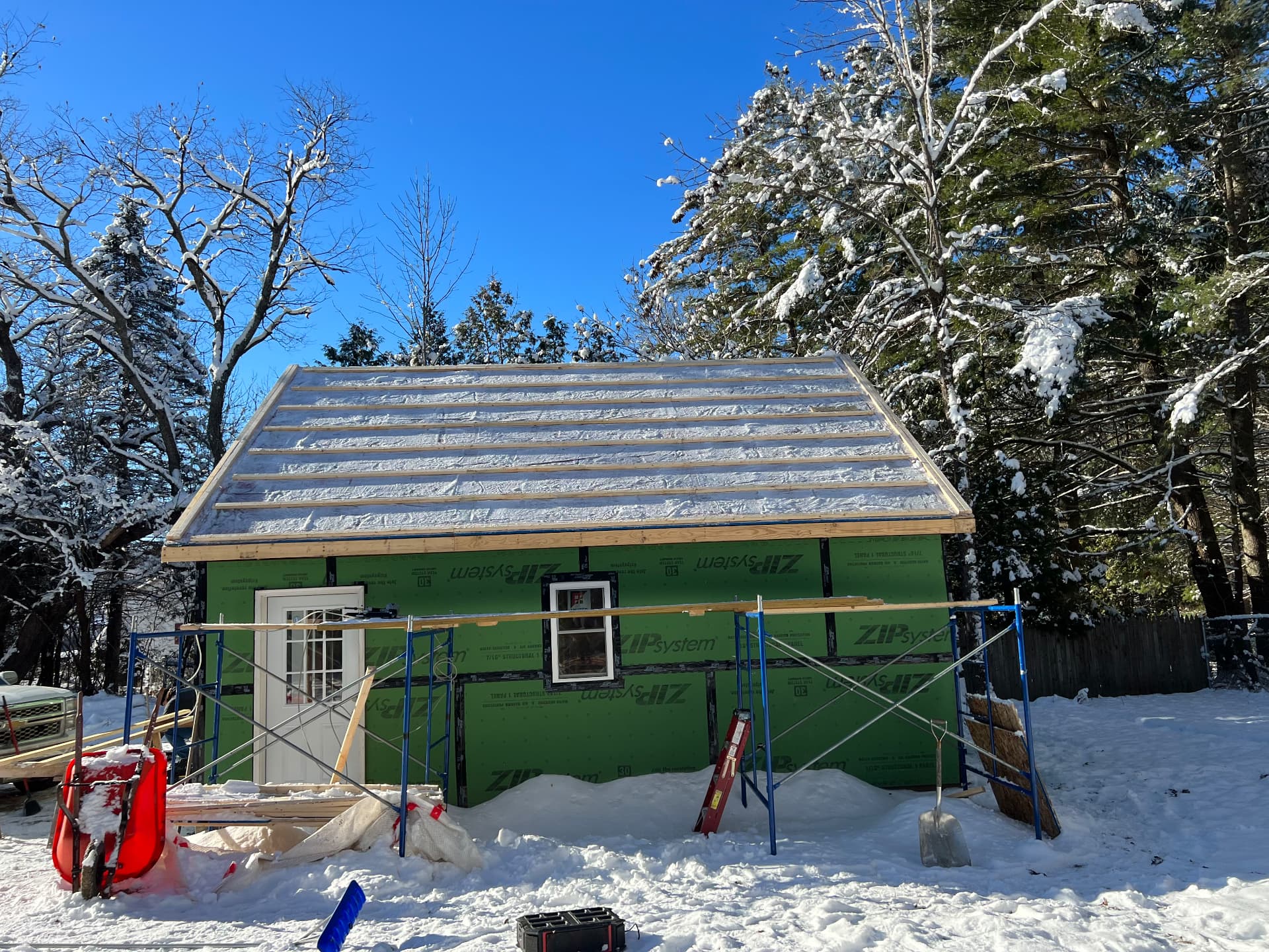 New outbuilding with ZIP System sheathing and strapped roof in winter