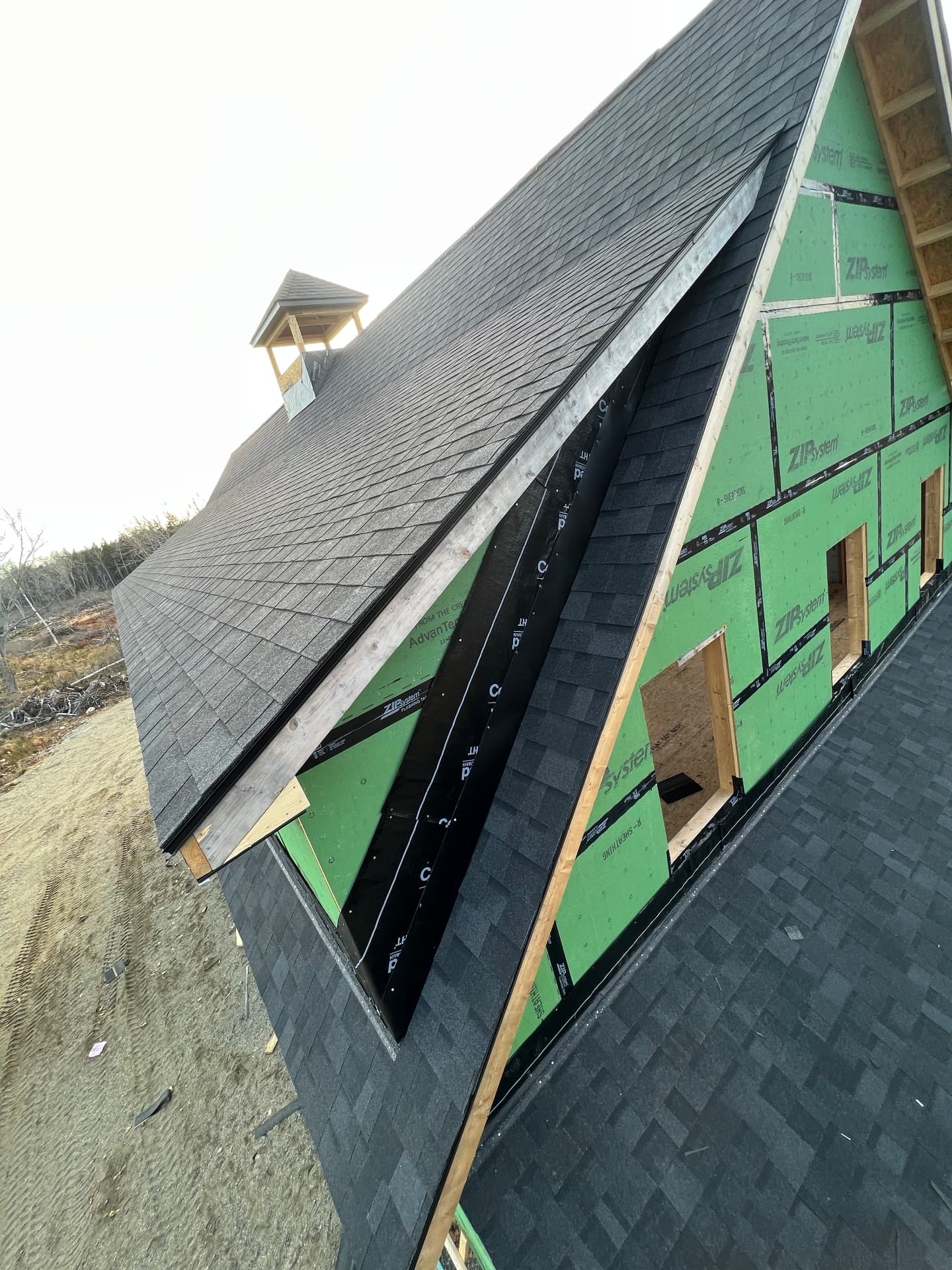 Dormer and roof valley detail with ZIP System sheathing on a new home