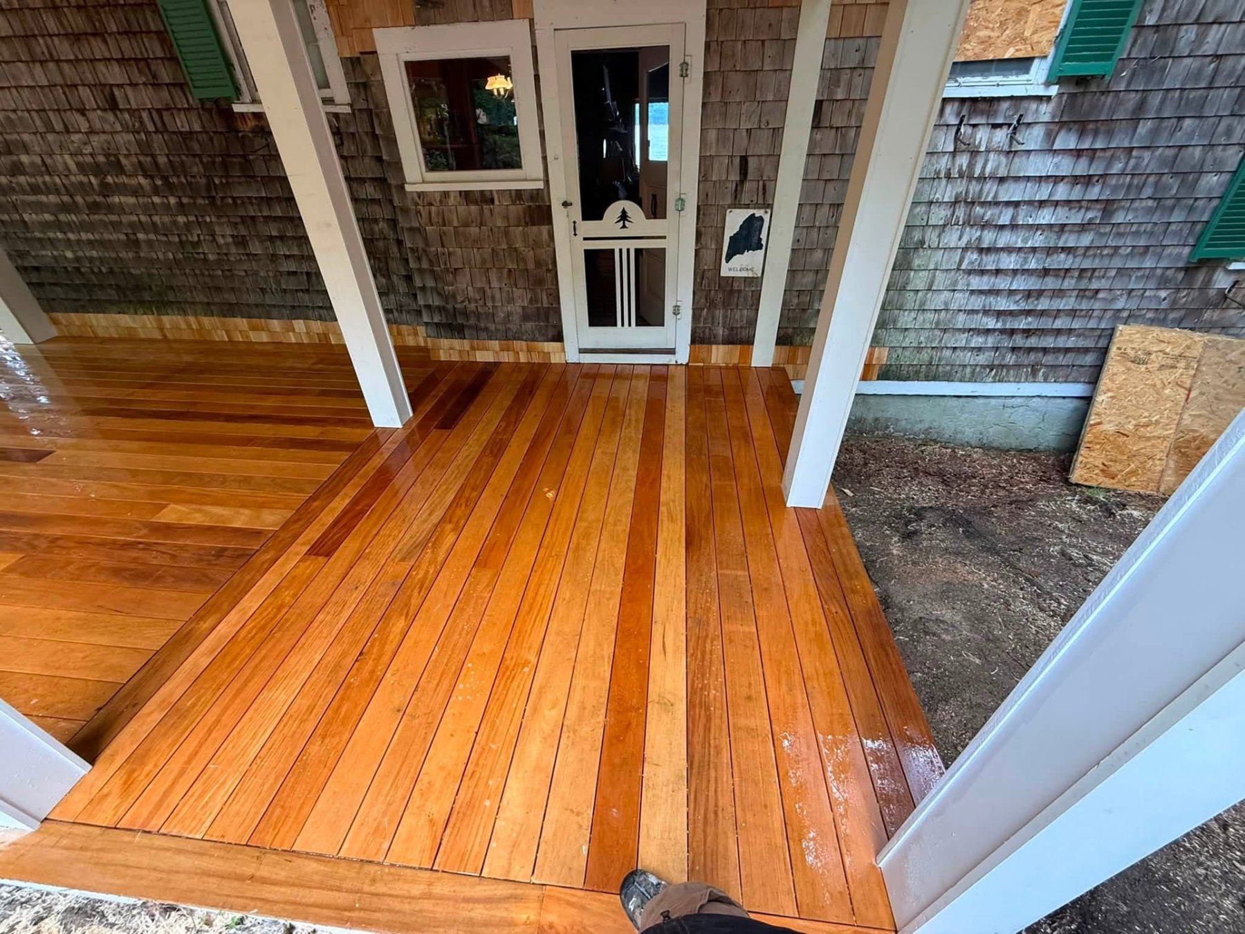 Finished mahogany porch decking at a shingled Maine cottage