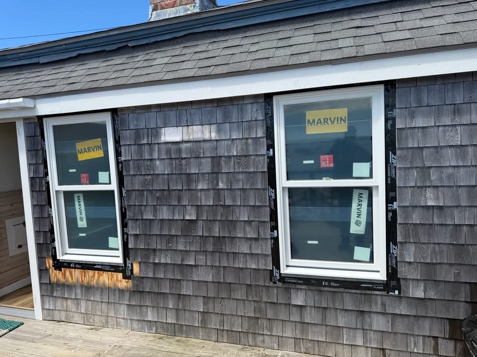 New Marvin windows installed in cedar shingle siding